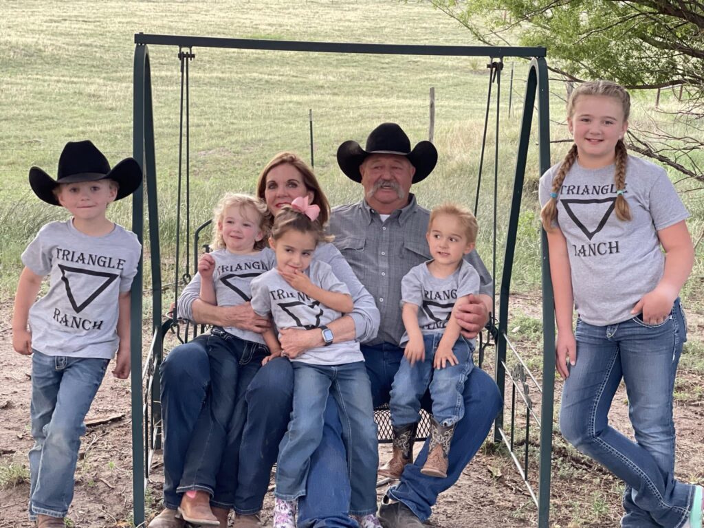 Jack and Jill Chatfield with their grandchildren on a ranch swing